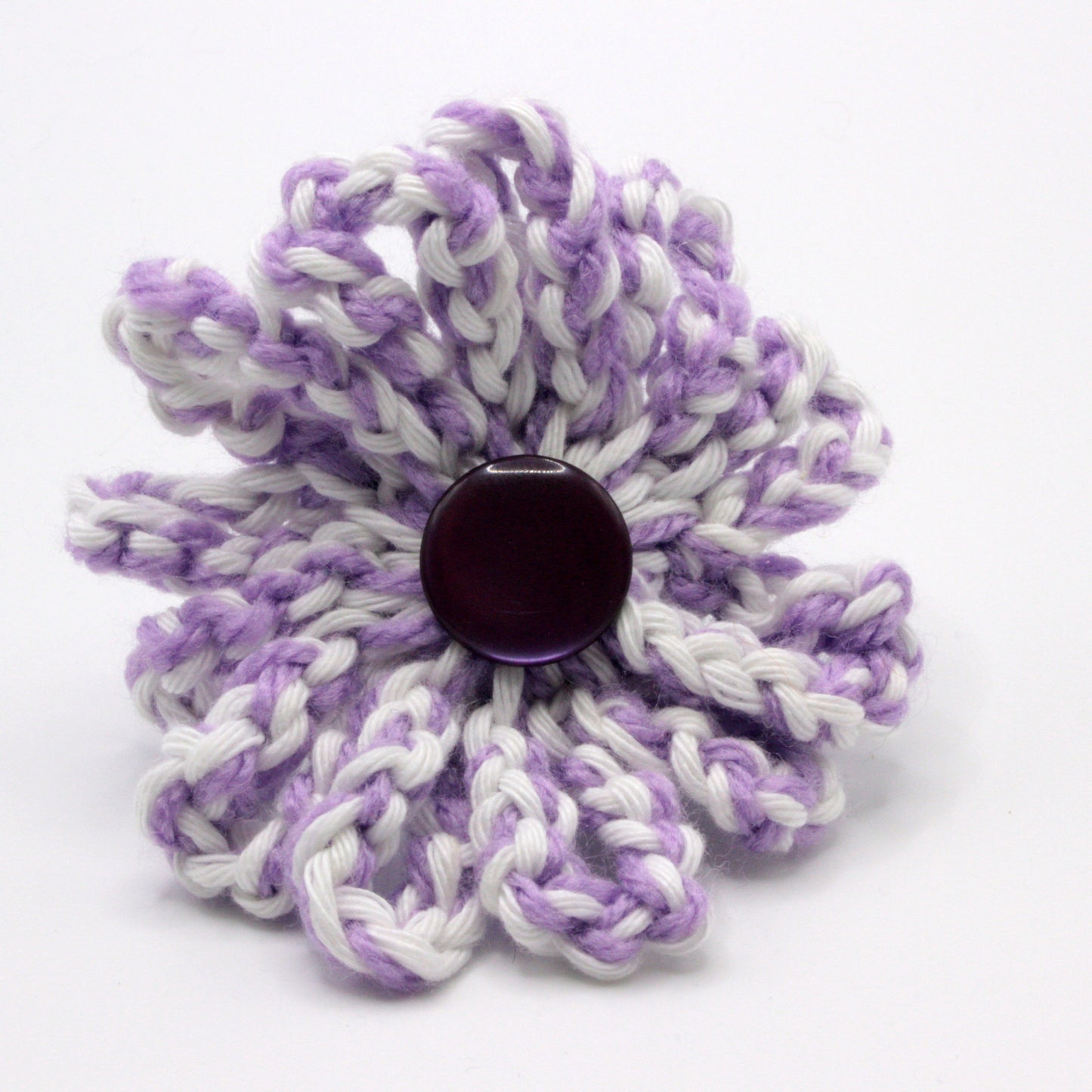 Floral-patterned product with a central dark button on a white background